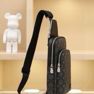 Alternative view of This shoulder bag features Damier Graphite canvas adorned with a Louis Vuitton Paris leather patch on the front exterior pocket. The adjustable nylon shoulder strap attaches to either side via D-rings, while the canvas shoulder strap and lining uphold sustainable principles.Damier Graphite coated canvas Cowhide leather trim Fabric lining Square metal hardware on front Main compartment Zippered front pocket Small zippered top pocket Non-removable, adjustable shoulder strap! Dimensions: 20x31x7 cm